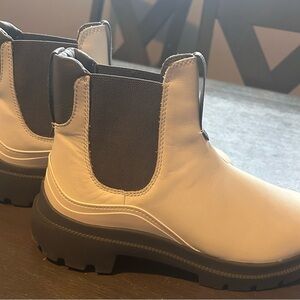 Stylish White and Black Olukai Boots